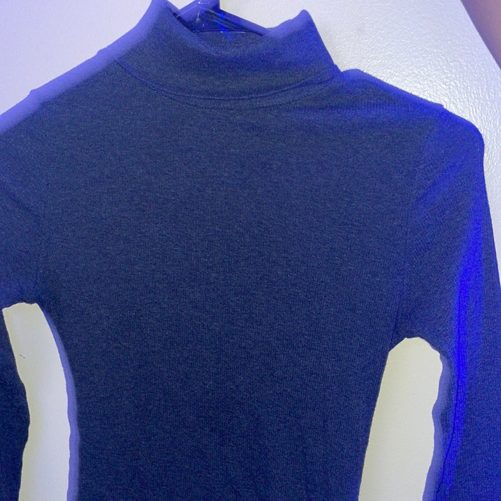 Grey turtleneck, medium size, ambiance branded.